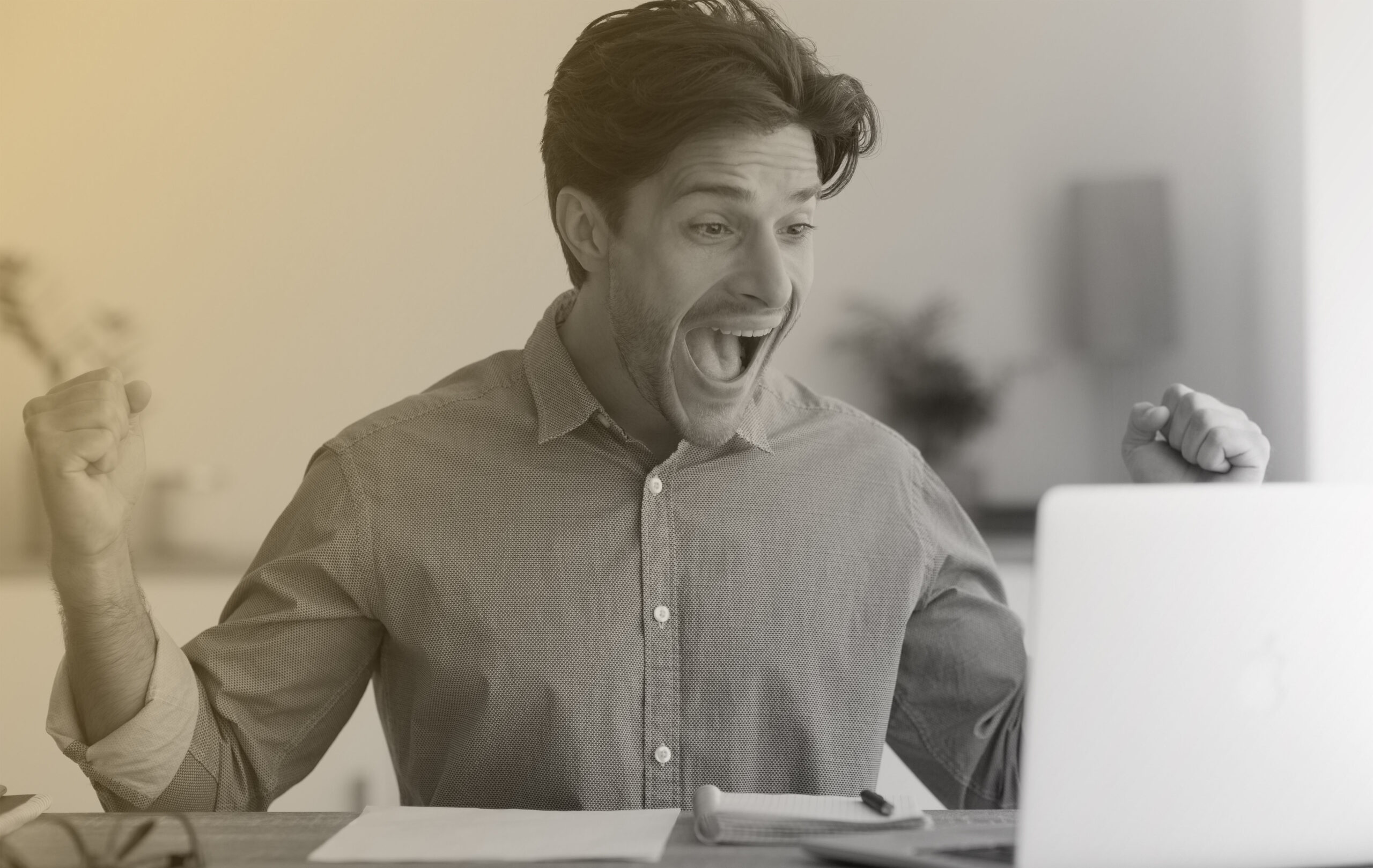 Man programming on a computer, office background